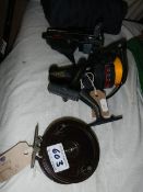 An Allcock fishing reel and two others.