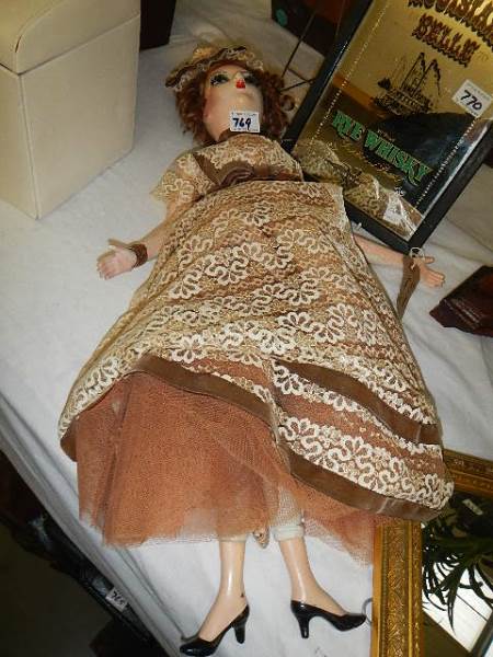 A 1920's French boudoir doll in good condition.