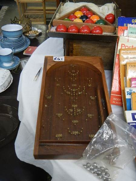 A Bagatelle and a quantity of pool balls.