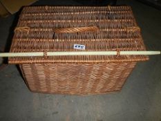 A wicker fishing creel.,