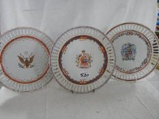 Three heraldic ribbon plates.