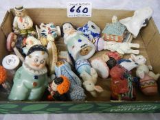 A mixed lot of small figures including salt and pepper pots.