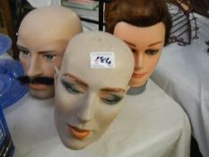 Three shop display heads.