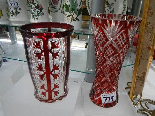 Two early 20th century overlaid cranberry glass vases.