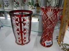 Two early 20th century overlaid cranberry glass vases.