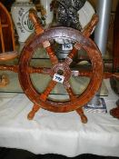 A mid 20th century ship's wheel.