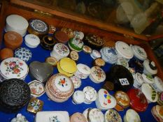 A large collection of pill and trinket boxes.