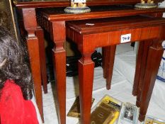 A mahogany nest of tables.