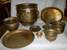 An old embosses brass jardiniere and other brass ware.