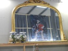 A large gilt framed overmantel mirror. *COLLECT ONLY*