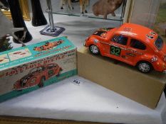 A boxed battery operated "Love Beetle",