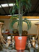 A tall artificial plant.