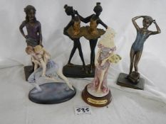 Five contemporary figurines.
