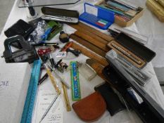A mixed lot of office items including hole punches, rulers etc.,