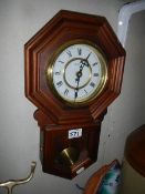 A mahogany drop dial wall clock, battery operated, in working order.
