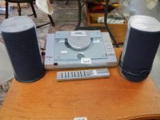A Bush record player with speakers.