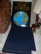 A quantity of world atlases.