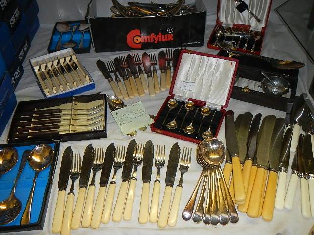 A large quantity of silver plate including canteen of cutlery, teapot, fish knives and forks etc.,