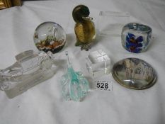 Eight assorted glass paperweights.