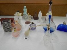 A mixed lot of perfume bottles, some with contents.