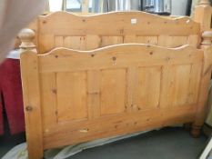 A pine double bed frame.