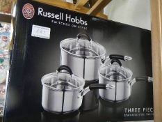 A new boxed Russell Hobbs three piece stainless steel pan set.