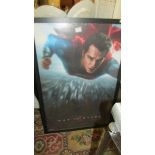 A large framed Superman poster.