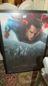 A large framed Superman poster.