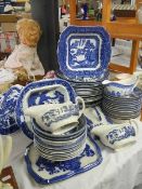 Approximately 40 pieces of blue and white dinner ware.