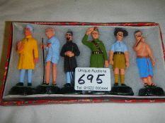 A box of six ceramic figures.