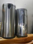 Two stainless steel waste bins.