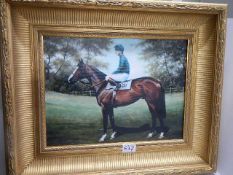 A gilt framed study of a racehorse with jockey on canvas. (This is a print)