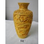 A Chinese style vase with dragons.