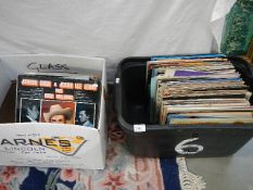 Two boxes of mixed albums.