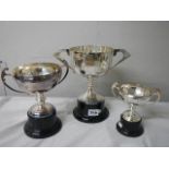 Three silver plate trophies.