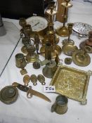 A mixed lot of brass ware including candlesticks, pressure gauge etc.,