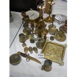 A mixed lot of brass ware including candlesticks, pressure gauge etc.,