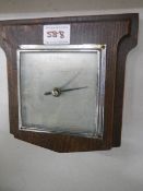 A square wall barometer.