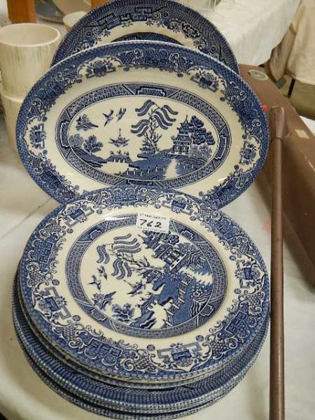 A mixed lot of blue and white plates.