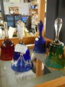 Four coloured glass bells.