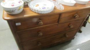 A two over two mahogany chest of drawers. COLLECT ONLY.