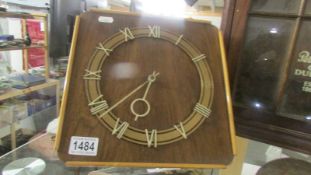 A 1930's wall clock (missing weights)