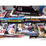 A selection of children's Star Wars books including Lego annuals, figures present in 2 of the