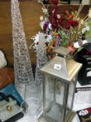 A pillar candle holder, vases, Christmas faux flowers and 2 decorative tree lights