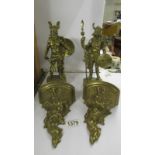 Two heavy brass Viking figures with two brass brackets.
