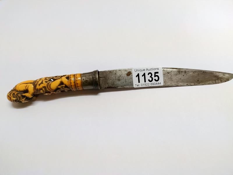 An antique knife with carved ivory handle, a/f.