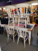 A solid pine kitchen table with painted legs & 4 chairs & a bench (table 80cm x 145cm x 75cm high)