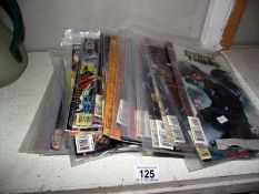 A quantity of Marvel and DC comics