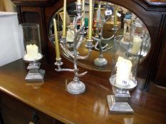 A pair of candlestick holders by culinary concept, London and an antler candelabra height 51cm