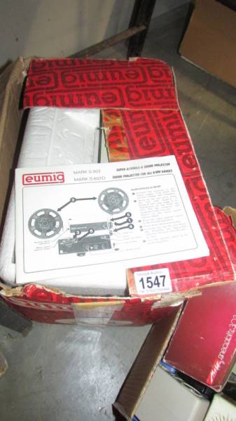 A Eumig Super 8 sound projector with instructions.